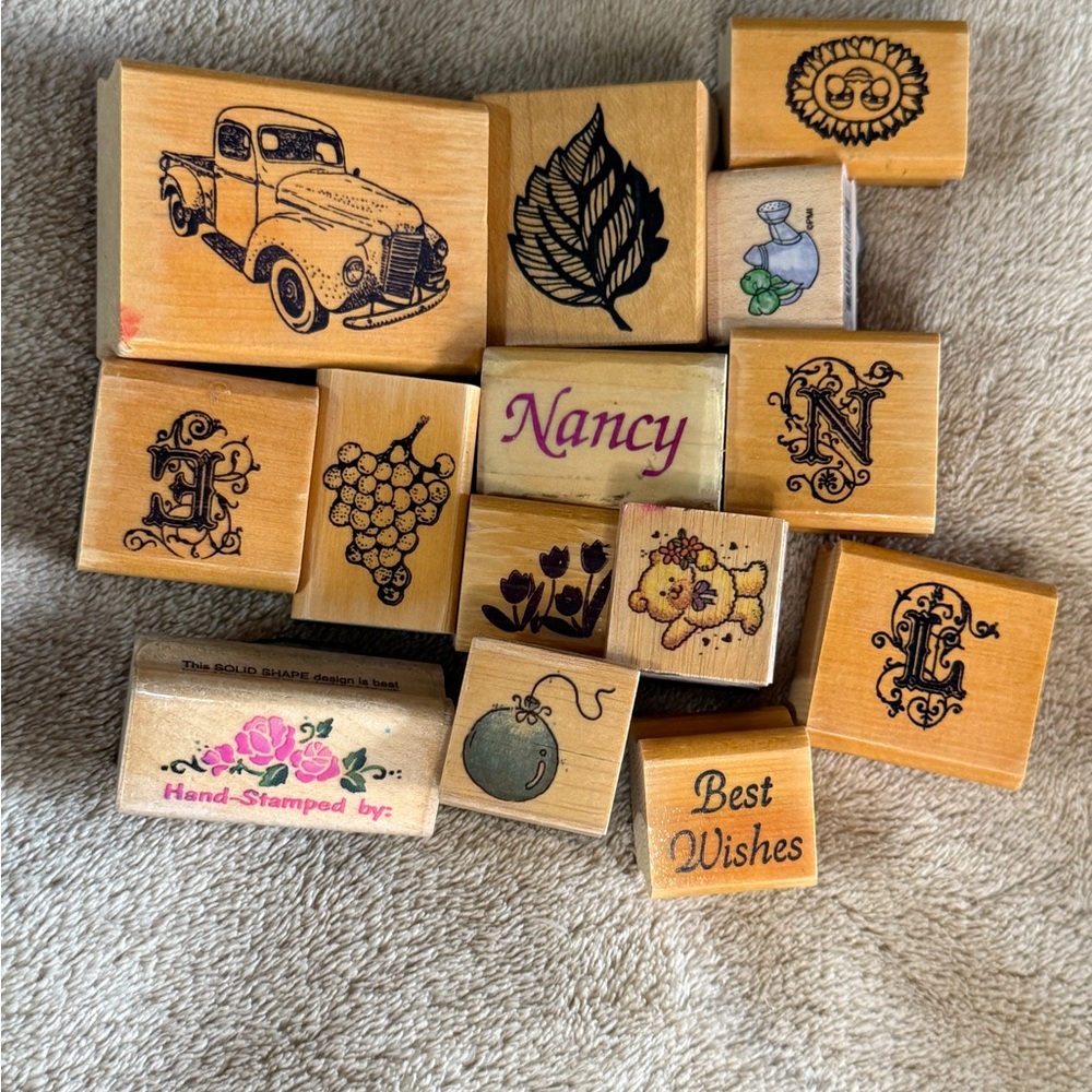 A nice bundle of 14 Rubber stamps on solid wood.